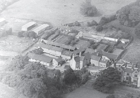 Aerial view, 1969, showing buildings and kitchen garden to the west of the house (Genius Photography)